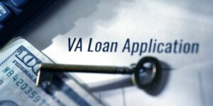 Close-up of VA Loan Application form with money and house key on a desk, symbolizing home financing and real estate process